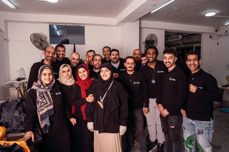 The XLabel production team in black XLabel tops