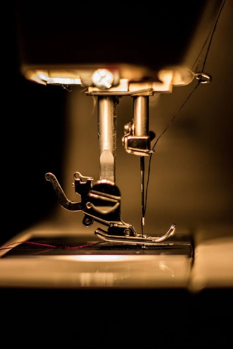 Sewing machine needle in warm light