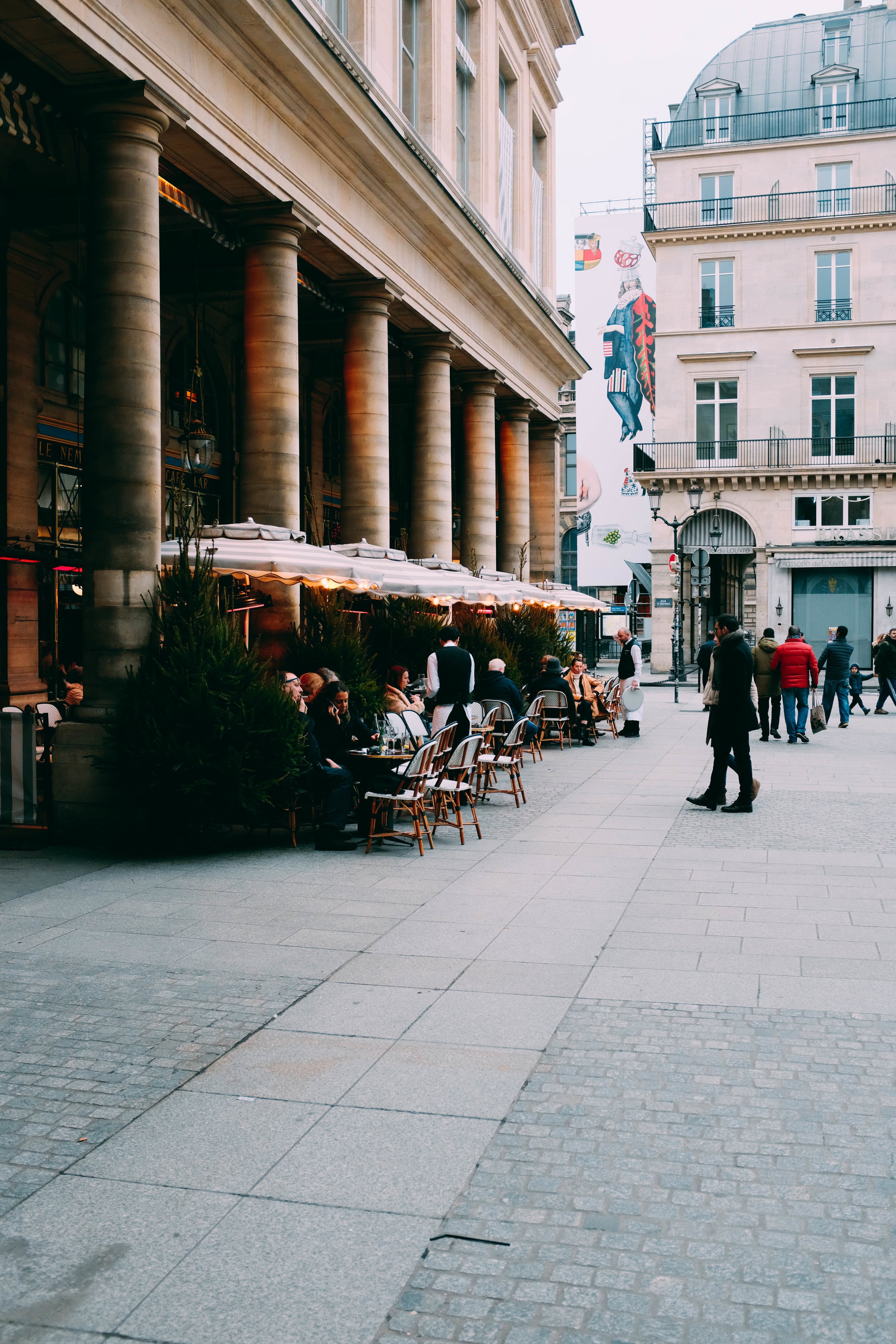 restaurant-tables-between-columns-on-a-piazza.jpg