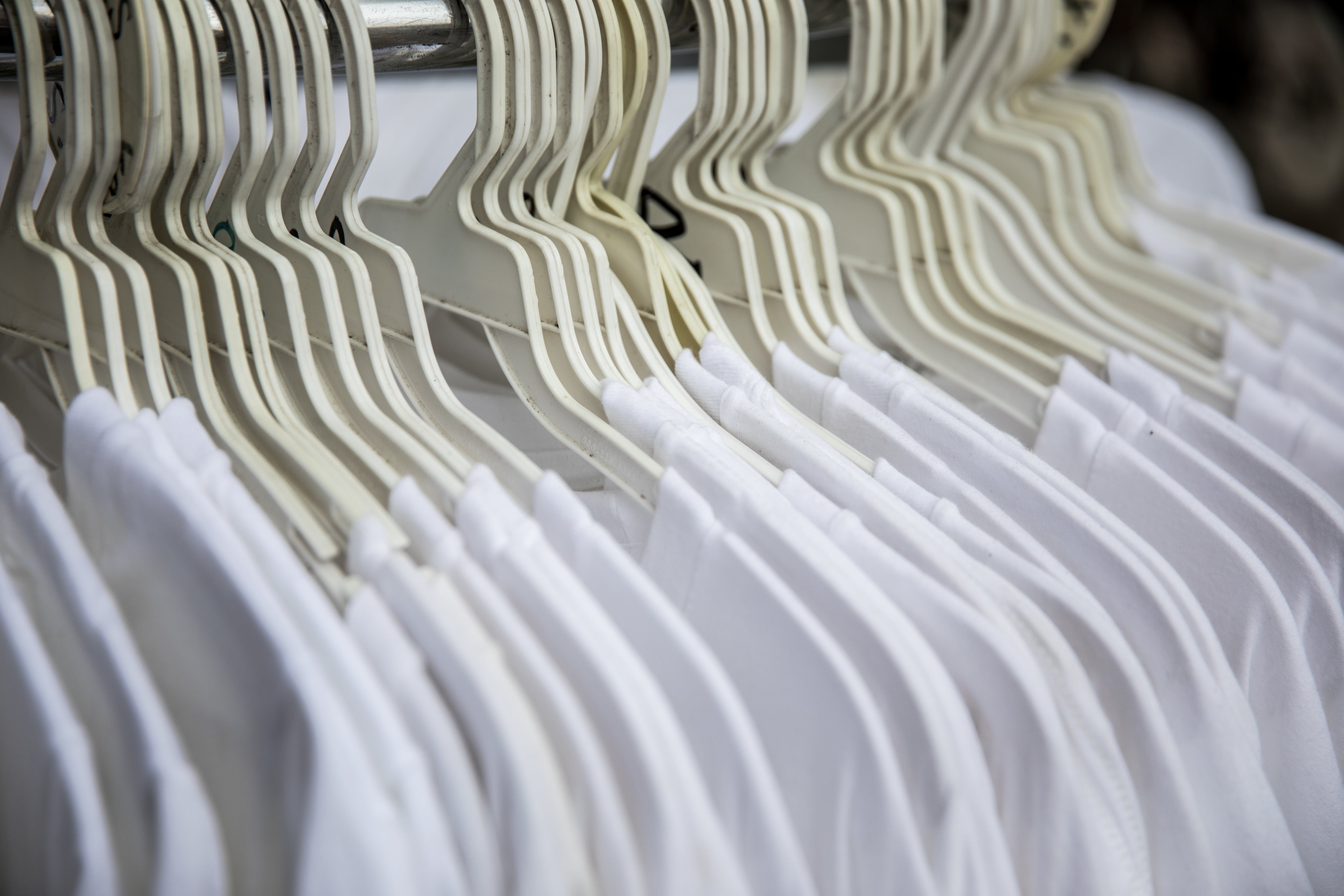 white-t-shirts-on-clothing-rack.jpg